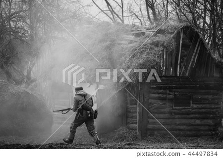 German Wehrmacht Infantry Soldier In WW II Running On Battlefiel German Wehrmacht Infantry Soldier In WW II Running On Battlefiel 44497834