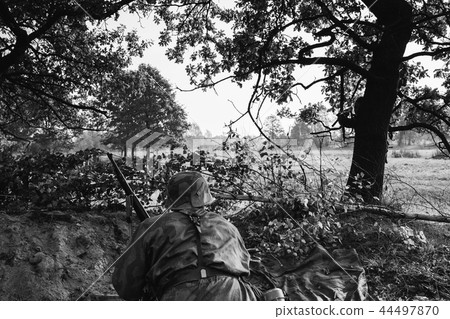 German Wehrmacht Infantry Soldier In World War II Hidden Sitting German Wehrmacht Infantry Soldier In World War II Hidden Sitting 44497870
