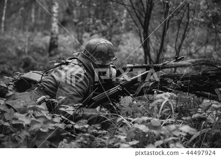 German Wehrmacht Infantry Soldier In World War II Hidden Sitting 44497924