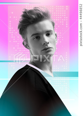Attractive young actor looking calm while posing for a photo Attractive young actor looking calm while posing for a photo 44498852