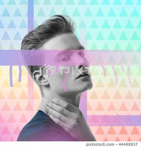 Young handsome sportsman touching his neck and feeling the pulse 44498937