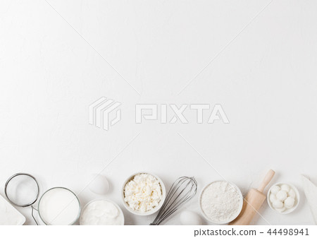 Fresh dairy products on white table background. Fresh dairy products on white table background. 44498941