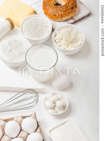 Fresh dairy products on white table background. Fresh dairy products on white table background. 44498942