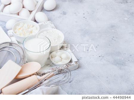 Fresh dairy products on white table background. Fresh dairy products on white table background. 44498944