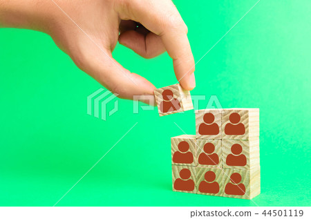 The leader builds team from cubes with employees 44501119