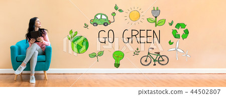Go green with woman using a tablet 44502807