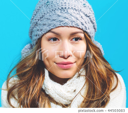Happy young woman in winter clothes 44503083