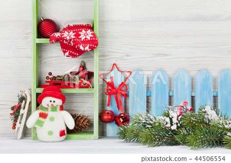 Christmas snowman toy, decor and fir tree branch 44506554