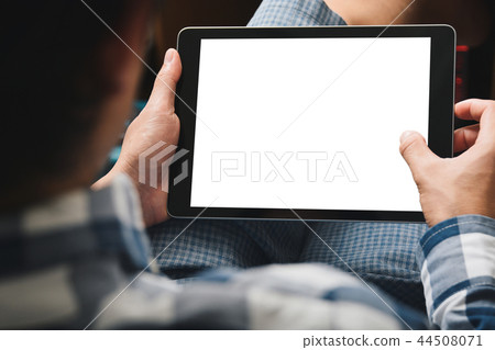 Mockup tablet image, Man using tablet computer while sitting relax on chair with Clipping path on 44508071
