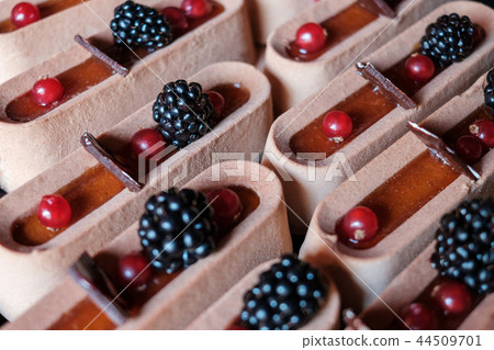 sweet tart cake pieces on dessert buffet 44509701