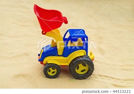 Toy tractor in sandbox 44513221