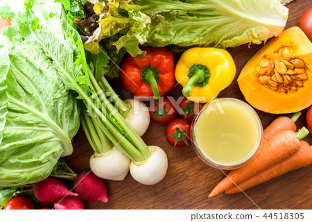 Smooth smoothie and vegetables wood grain table overhead view 44518305