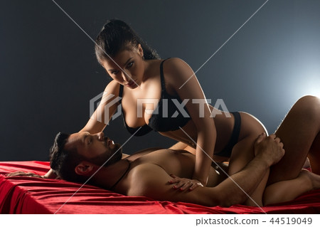 Loving man and woman embracing in bed view 44519049