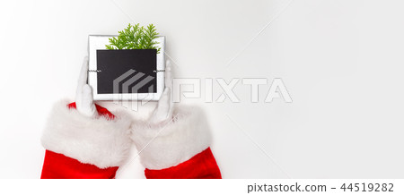Santa holding a Christmas gift 44519282