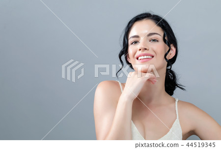 Beautiful young woman with skin care theme 44519345