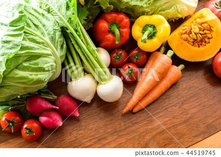 Many vegetables wood grain table 44519745