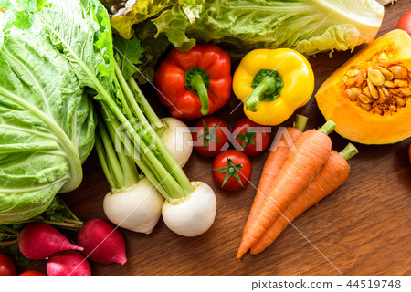Many vegetables wood grain table 44519748