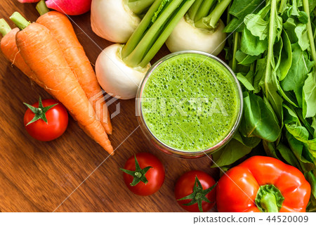 Green smoothie and vegetables wood grain table Green smoothie and vegetables wood grain table 44520009