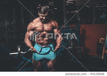 Handsome model muscle man abs workout in gym 44520696