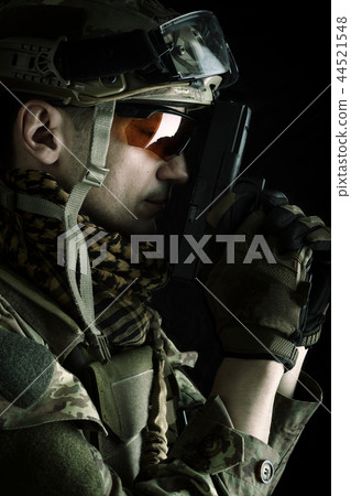 Macro view of military man with gun 44521548