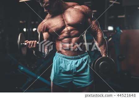 Handsome model muscle man abs workout in gym 44521648