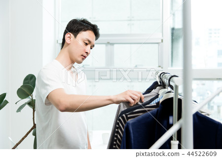Men choosing clothes Men choosing clothes 44522609