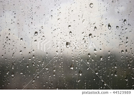 drop of water on window glass during raining day drop of water on window glass during raining day 44523989