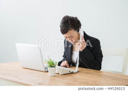 Woman apologizing on the phone Woman apologizing on the phone 44526013