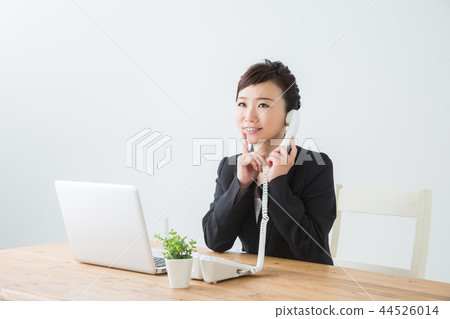 Woman thinking on the phone Woman thinking on the phone 44526014