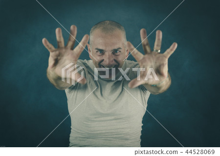 Man Showing Palms Like Casting a Spell 44528069