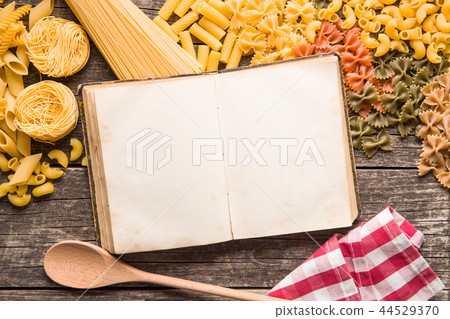 Various types of italian pasta and blank cookbook. Various types of italian pasta and blank cookbook. 44529370