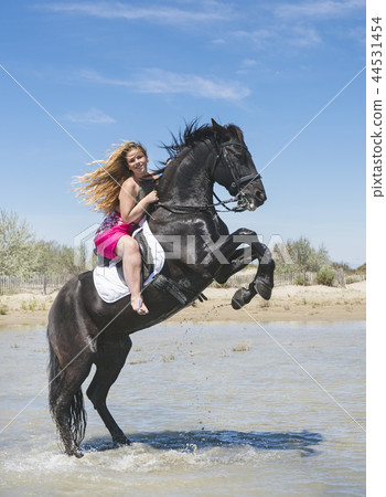 riding girl on the beach 44531454