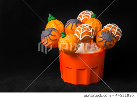 concept of Halloween party with glazed cake pops concept of Halloween party with glazed cake pops 44531950
