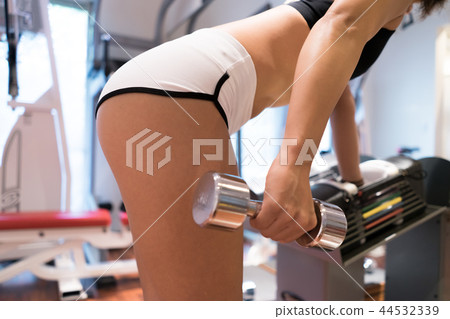 Woman training at the gym Woman training at the gym 44532339