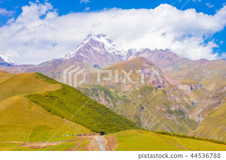 Mount Kazbek beautiful view from Gergeti Trinity Church Tsminda Sameba in summer sanny day. It is a 44536788