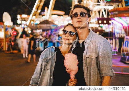 Lovely young hipster couple dating during summer sunset. 44539461
