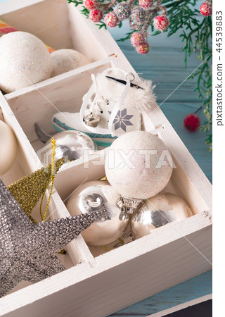 Christmas wooden tray with toys. Antique stars and balls on wooden table. Close up Christmas wooden tray with toys. Antique stars and balls on wooden table. Close up 44539883
