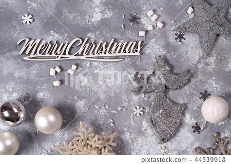 christmas composition with silver New Year's toys on gray stone background/ Christmas card with christmas composition with silver New Year's toys on gray stone background/ Christmas card with 44539918
