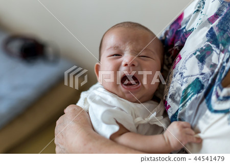 Newborn baby and grandmother Newborn baby and grandmother 44541479