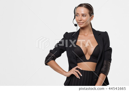 Lady with deep neckline and head microphone 44541665