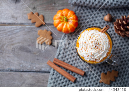 Pumpkin latte with spices. Boozy cocktail with whipped cream. Top view. Copy space. Pumpkin latte with spices. Boozy cocktail with whipped cream. Top view. Copy space. 44542458