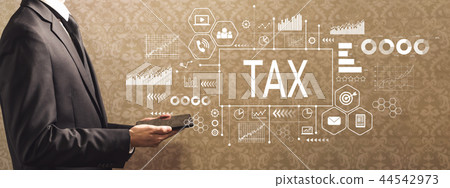 Tax with businessman holding a tablet computer  44542973