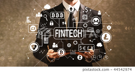 Cryptocurrency fintech theme with businessman holding a tablet c Cryptocurrency fintech theme with businessman holding a tablet c 44542974