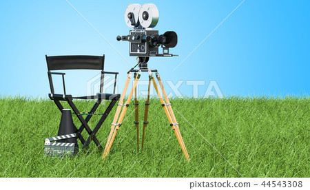 Cinema concept. Movie camera with film reels Cinema concept. Movie camera with film reels 44543308