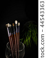 Brushes in glass with glass 44543363