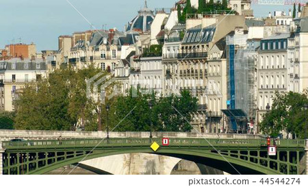 View to the bridge and traditional residential houses in Paris, France 44544274