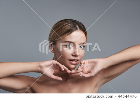 Cute woman putting two hands together and looking at you Cute woman putting two hands together and looking at you 44544476