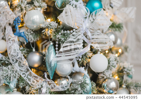 Christmas tree background decorated with balls, stars and lights Christmas tree background decorated with balls, stars and lights 44545095