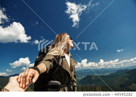 Jolly woman is enjoying mountainous landscape with follower Jolly woman is enjoying mountainous landscape with follower 44545282