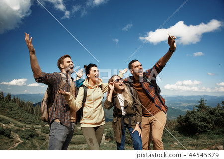 Merry friends are taking selfie in mountains 44545379